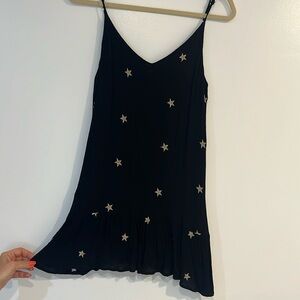 Storia star guaze dress with adjustable straps and metallic gold stars.